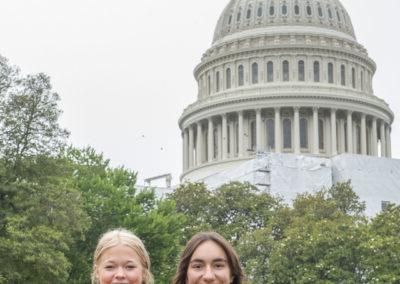 2 students in front of the US Capital building for the 2023 Youth Tour